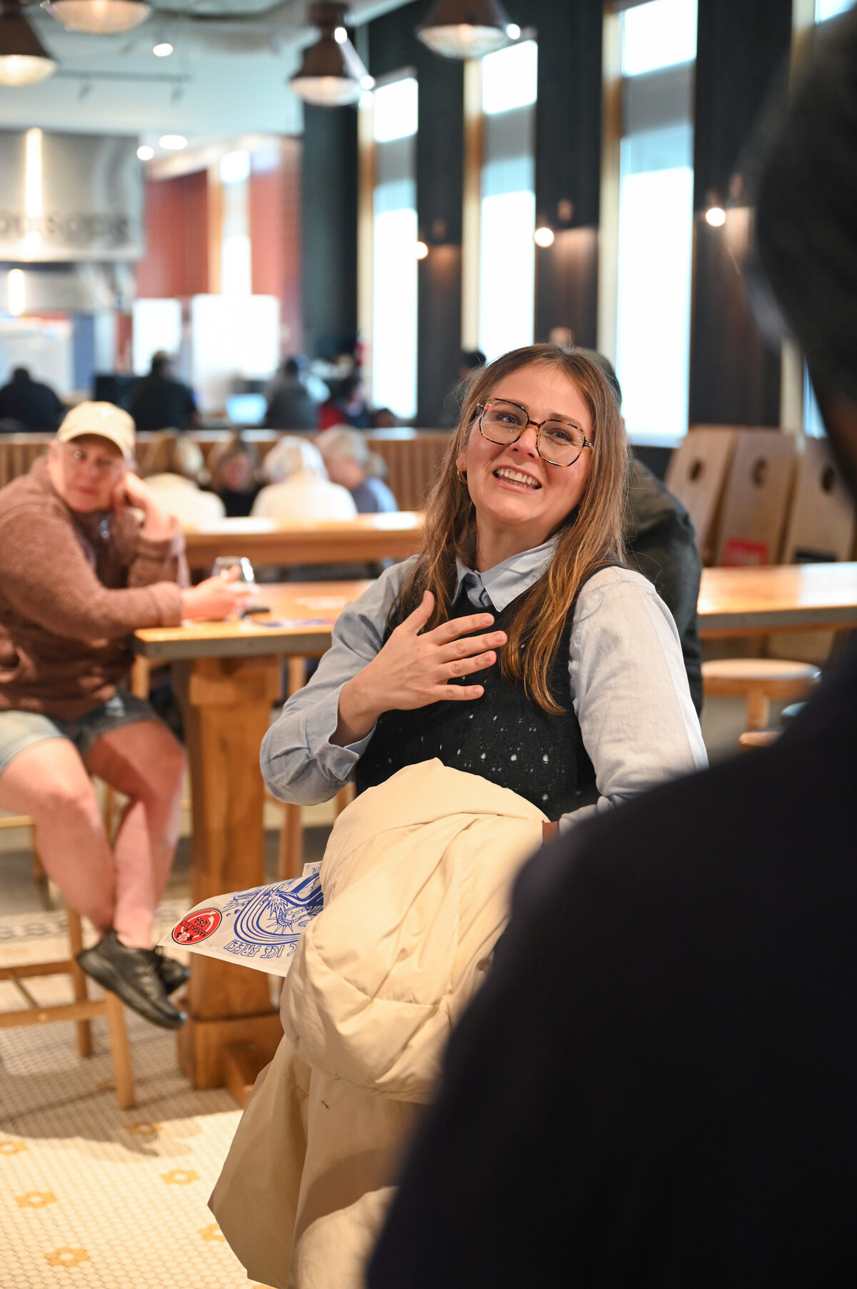 Sarah Preu talking with voters at a community coffee shop