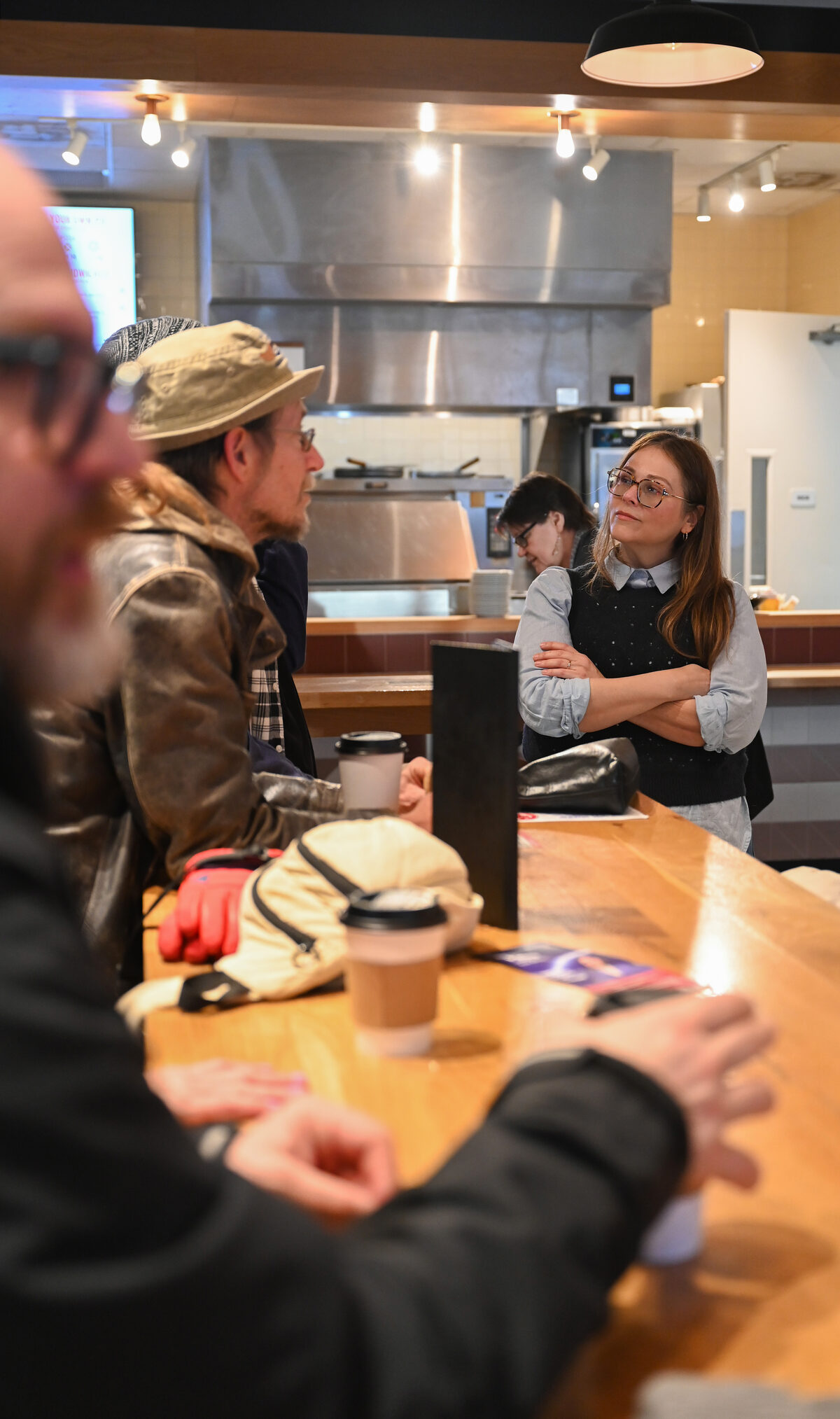 Sarah Preu listening to constituents at a local gathering